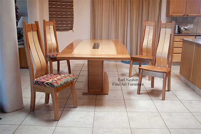 custom made contemporary dining table shown with all four chairs